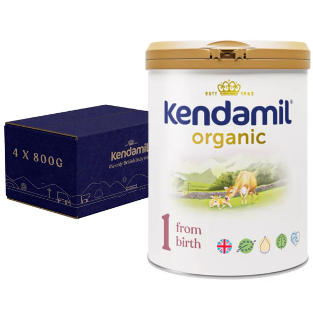 A canister of Kendamil Organic First Infant Milk, with a label showing a green field and cow, indicating it is organic.