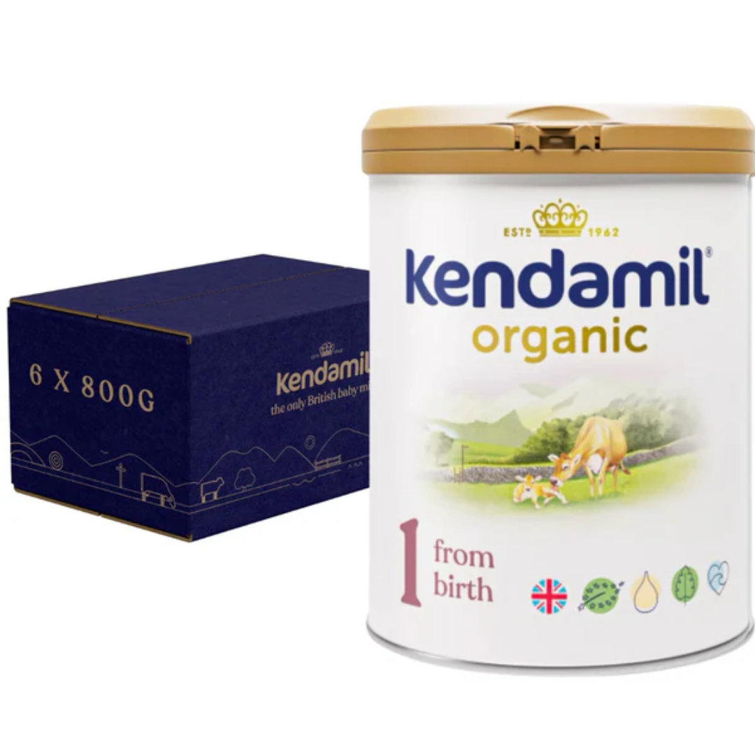 A canister of Kendamil Organic First Infant Milk, with a label showing a green field and cow, indicating it is organic.