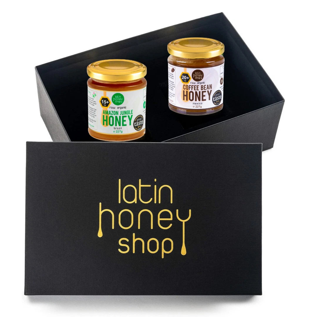 Two jars of honey in a black gift box with 'latin honey shop' branding