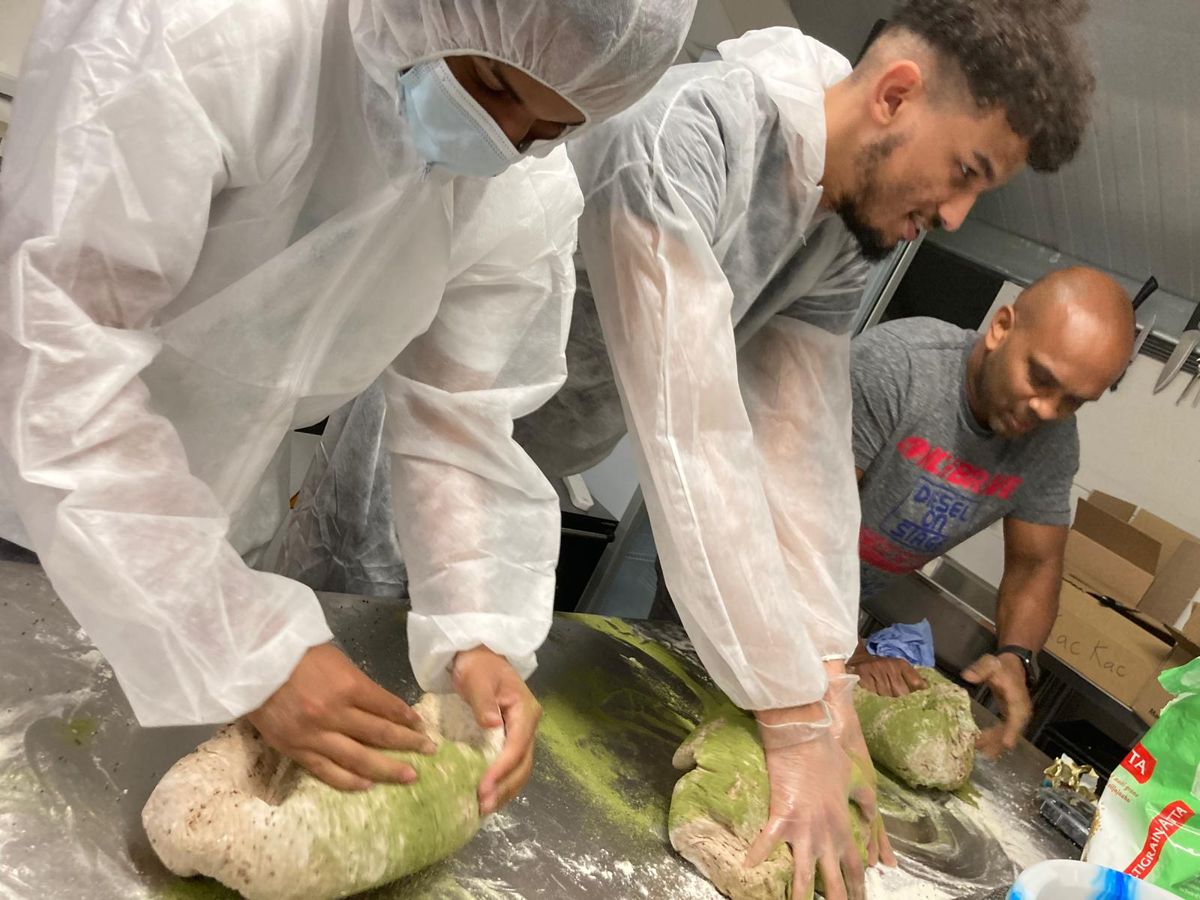 Team developing sweet potato dough in a development kitchen