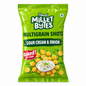 A bag of Manna Millet Bites Multigrain Shotz in Sour Cream & Onion flavor, featuring a bright green packaging design with an illustration of golden millet balls and a bowl of sour cream dip.