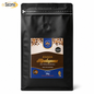 A 1kg black stand-up pouch of Kaa'wa Molo'opoma (Ou'Uhuahuhubaka) coffee by Taste the Difference, featuring a colorful front label and a Sacoma logo in the top left corner.