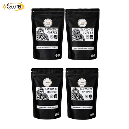 Four black stand-up coffee pouches arranged in a 2x2 grid on a white background, with the Sacoma logo in the top-left corner. Each pouch is labeled Kanyoni Coffee, showing dark roast and light roast ground coffee options.