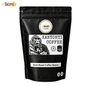 A black stand-up pouch of Sacoma Kanyoni Coffee Dark Roast Coffee Beans, featuring a white label with a gorilla illustration and product details, on a white background.