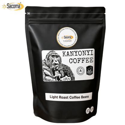A black stand-up pouch of Sacoma Kanyoni Coffee Light Roast Coffee Beans, featuring a white label with a gorilla illustration and product details, on a white background.