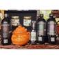 A gift hamper basket containing various health-related products including bottles labeled 'Nano Iron', 'Nano Zinc', and 'Nano Magnesium', jars of 'Manuka Honey' and 'Marmalade', and a small terracotta pot with the text 'Health is Organic'.